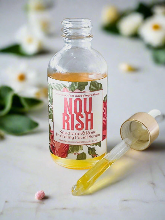 2oz Nourish Facial Serum in eco-friendly glass bottle with dropper – handcrafted blend of organic squalane, rosehip, and vitamin-rich botanical oils.