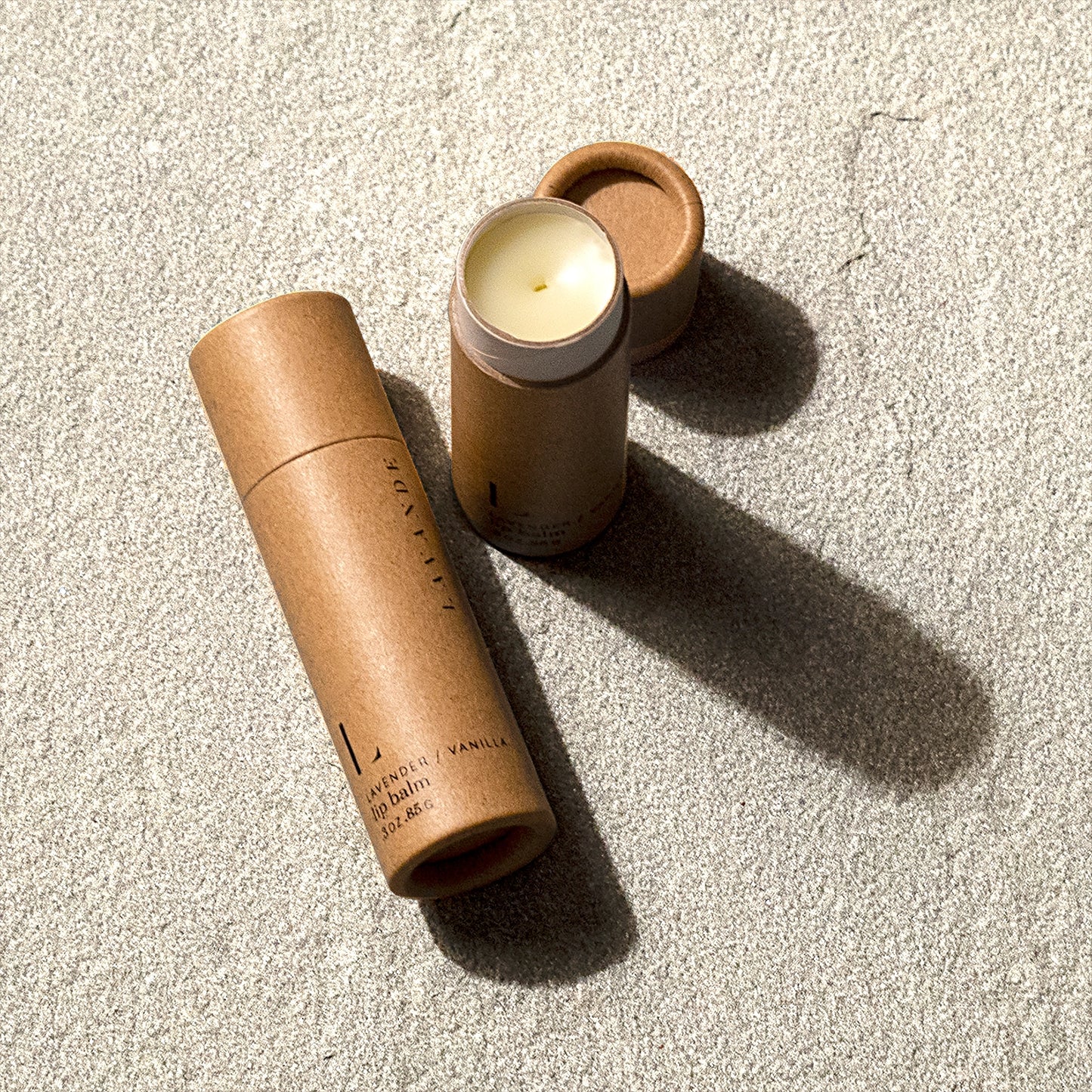 Close-up of creamy, ultra-hydrating natural lip balm in zero-waste packaging – made with lavender, beeswax, and nourishing botanical oils.
