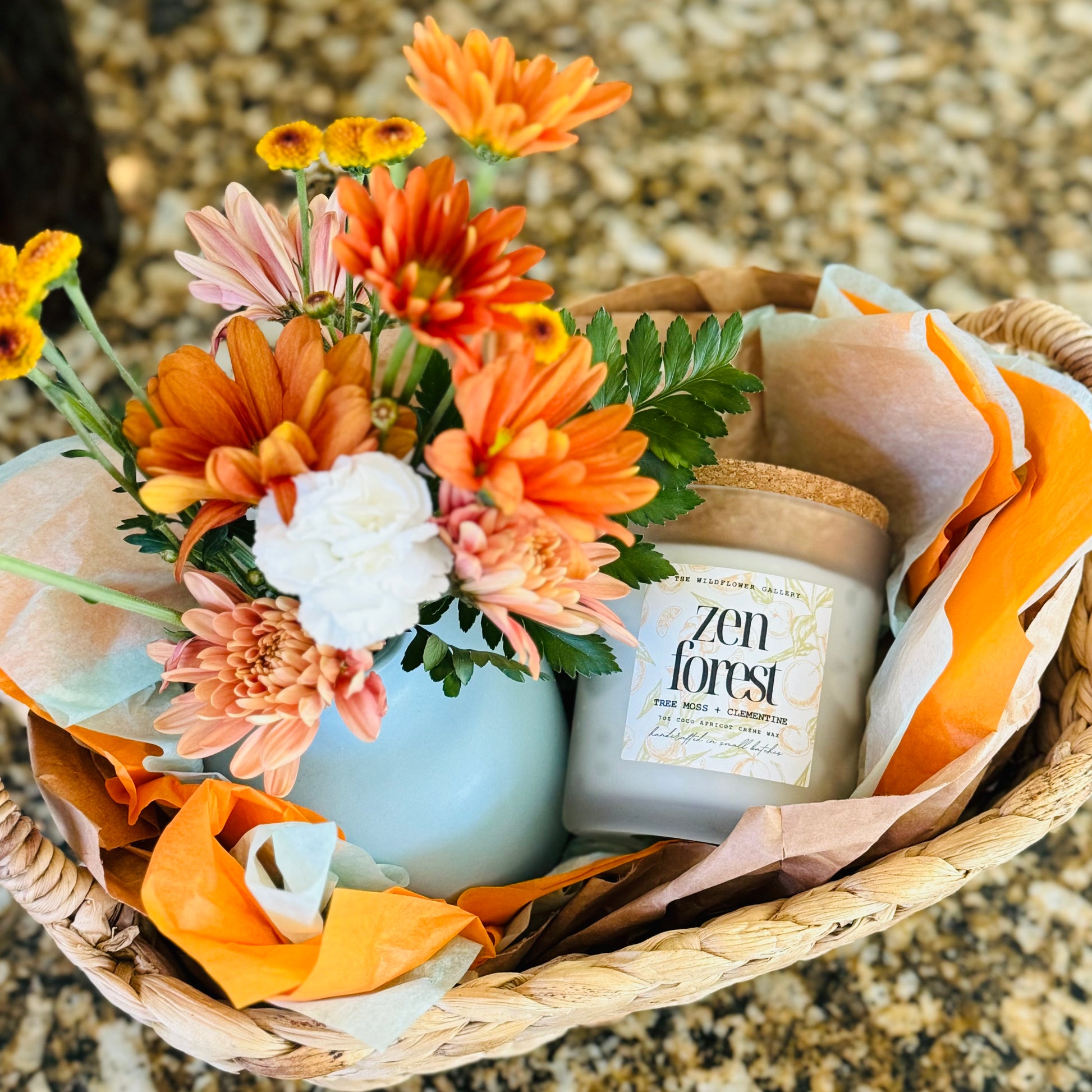 Artisan Bloom Basket from The Wildflower Gallery being hand-delivered in Friendswood, Texas – includes fresh flowers, non-toxic candle, and personalized gift items.