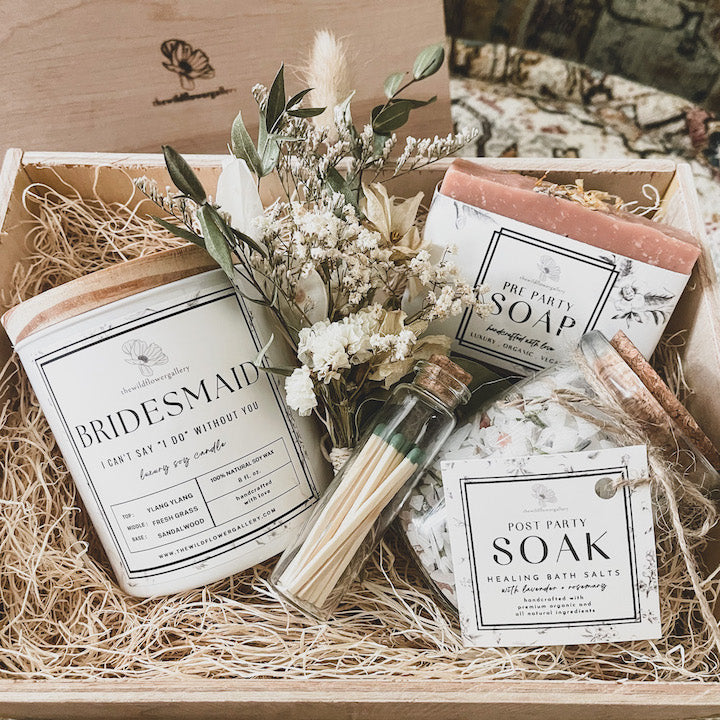 Bridesmaid-themed wellness gift box with handcrafted candle, body oil, velvet scrunchie, and personalized note – elegant self-care set for bridal party gifting.