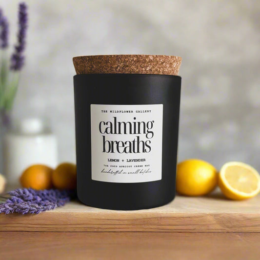 Calming Breaths candle with lemon & lavender scent in a black matte recycled glass jar with cork lid – non-toxic, clean-burning, handcrafted coconut apricot wax candle.