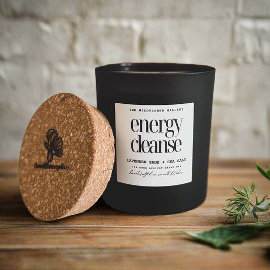 Energy Cleanse candle with sage, lavender & sea salt scent in a black matte recycled glass jar with cork lid – non-toxic, clean-burning, handcrafted coconut apricot wax candle.