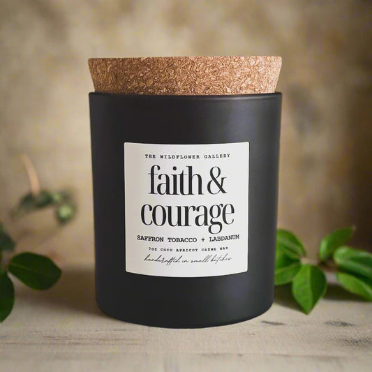 Faith & Courage candle with saffron, tobacco & labdanum scent in a black matte recycled glass jar with cork lid – non-toxic, clean-burning, handcrafted coconut apricot wax candle.