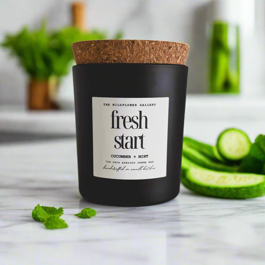Fresh Start candle with cucumber & mint scent in a black matte recycled glass jar with cork lid – non-toxic, clean-burning, handcrafted coconut apricot wax candle.