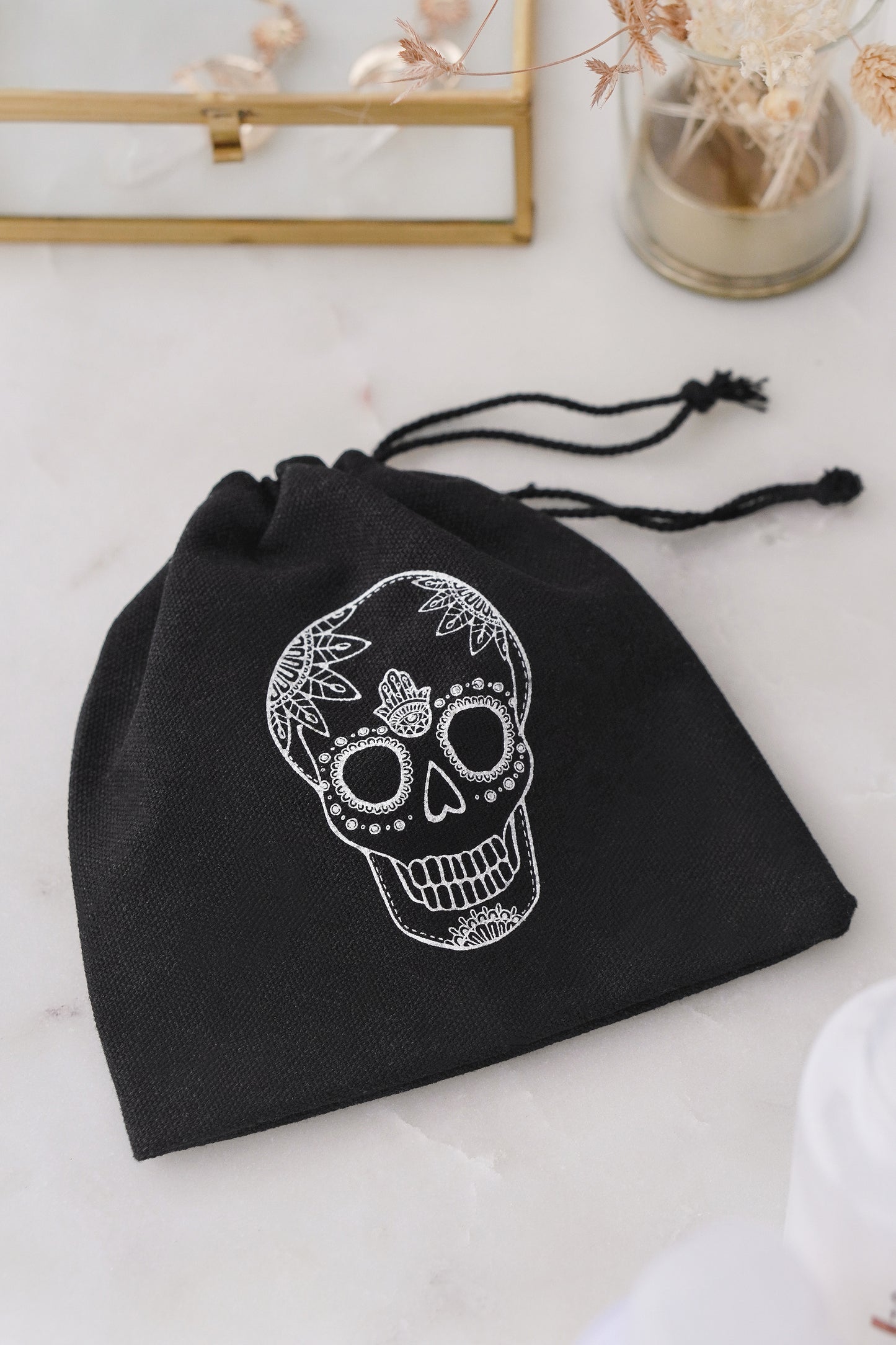 dia de los muertos skull and hamsa hand gift bag in black