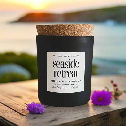 Seaside Retreat candle with wildflowers & coastal air scent in a black matte recycled glass jar with cork lid – non-toxic, clean-burning, handcrafted coconut apricot wax candle